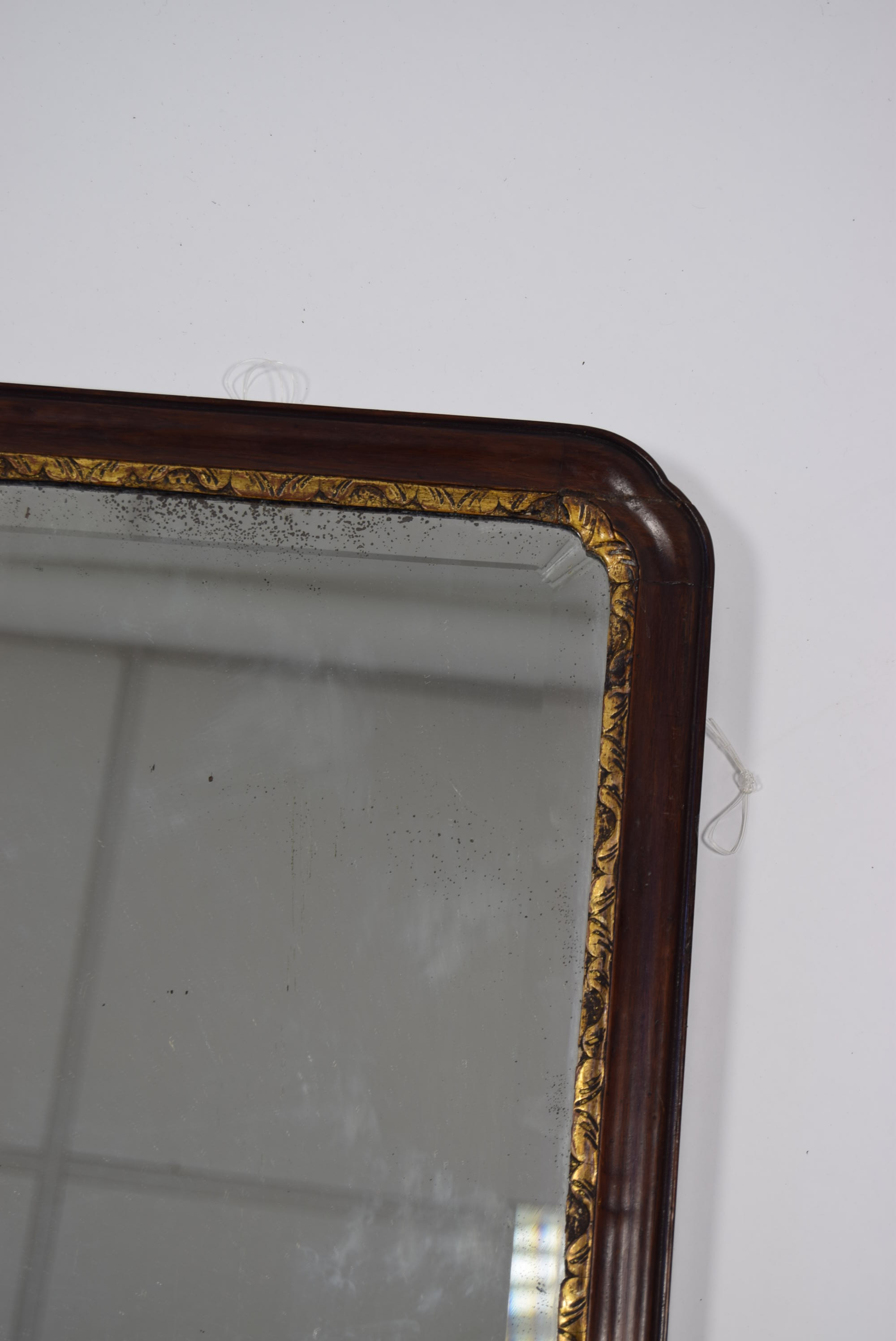 An early 19th century mahogany & parcel-gilt frame rectangular bevelled wall mirror; 30¾” x 18¾”. - Image 2 of 3