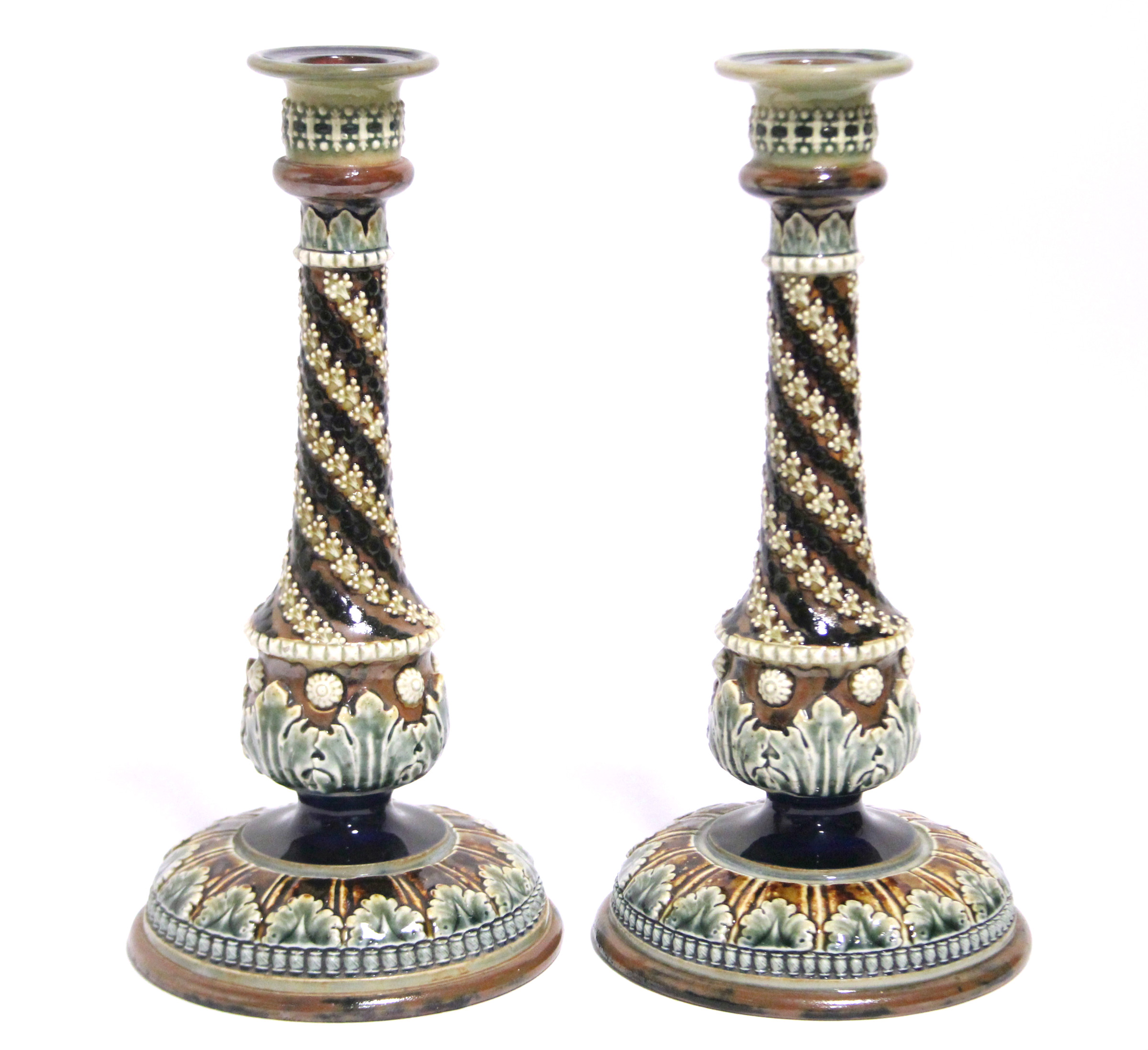 A pair of Doulton Lambeth stoneware candlesticks with round tapered columns &on circular domed