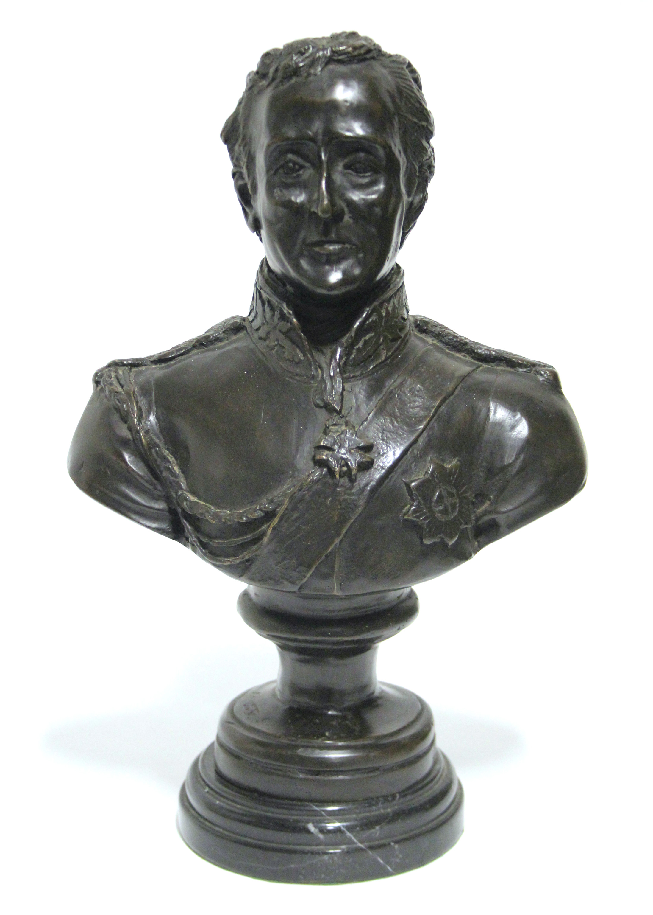 A bronze bust of the Duke of Wellington, on round black marble socle; 14” high over-all.