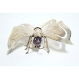 A continental .925 standard model of a butterfly with articulated abdomen & amethyst-quartz head;