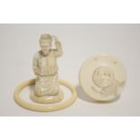 An oriental carved ivory kneeling figure of a woman, 3½” high; a Japanese ivory circular box with