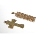 A 9ct. gold ingot pendant with cast & pierced scroll border; & a 9ct. gold crucifix pendant. (16.8gm