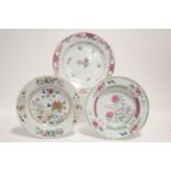 Two 18th century Chinese famille rose floral decorated 9" diam. soup plates; & a similar 9¼"