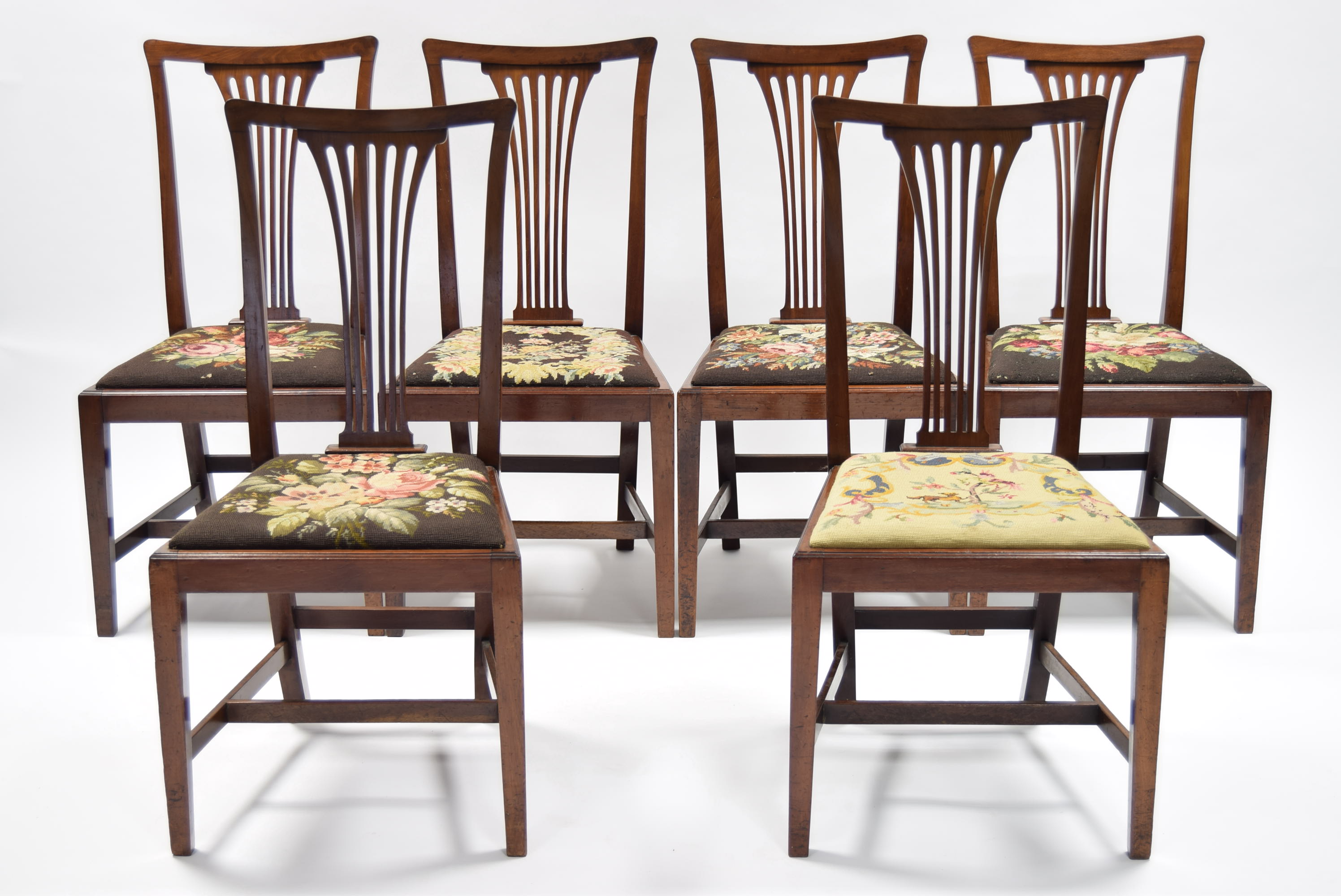 A set of six 19th century mahogany dining chairs with pierced splat backs, padded drop-in seats