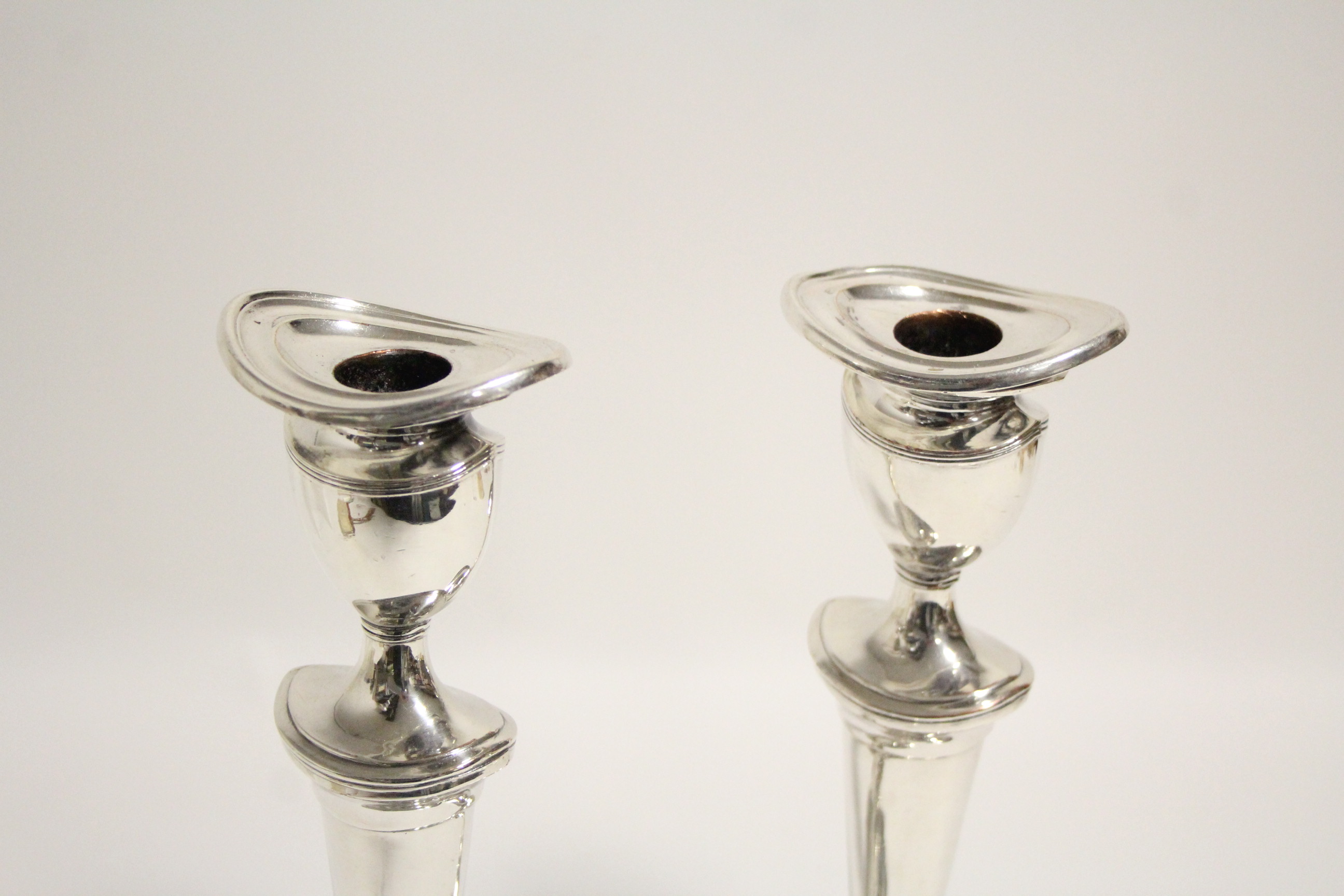 A pair of late 18th century style candlesticks with oval tapered columns, removable drip-pans to the - Image 2 of 2