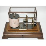 An early 20th century barograph by Pastorelli & Rapkin of Hatton Garden, in oak case with bevelled