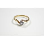 An 18ct. gold ring set single cushion-shaped diamond of approximately 0.25 carat.