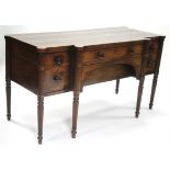 A regency inlaid mahogany breakfront sideboard, fitted single frieze drawer, a deep drawer to either