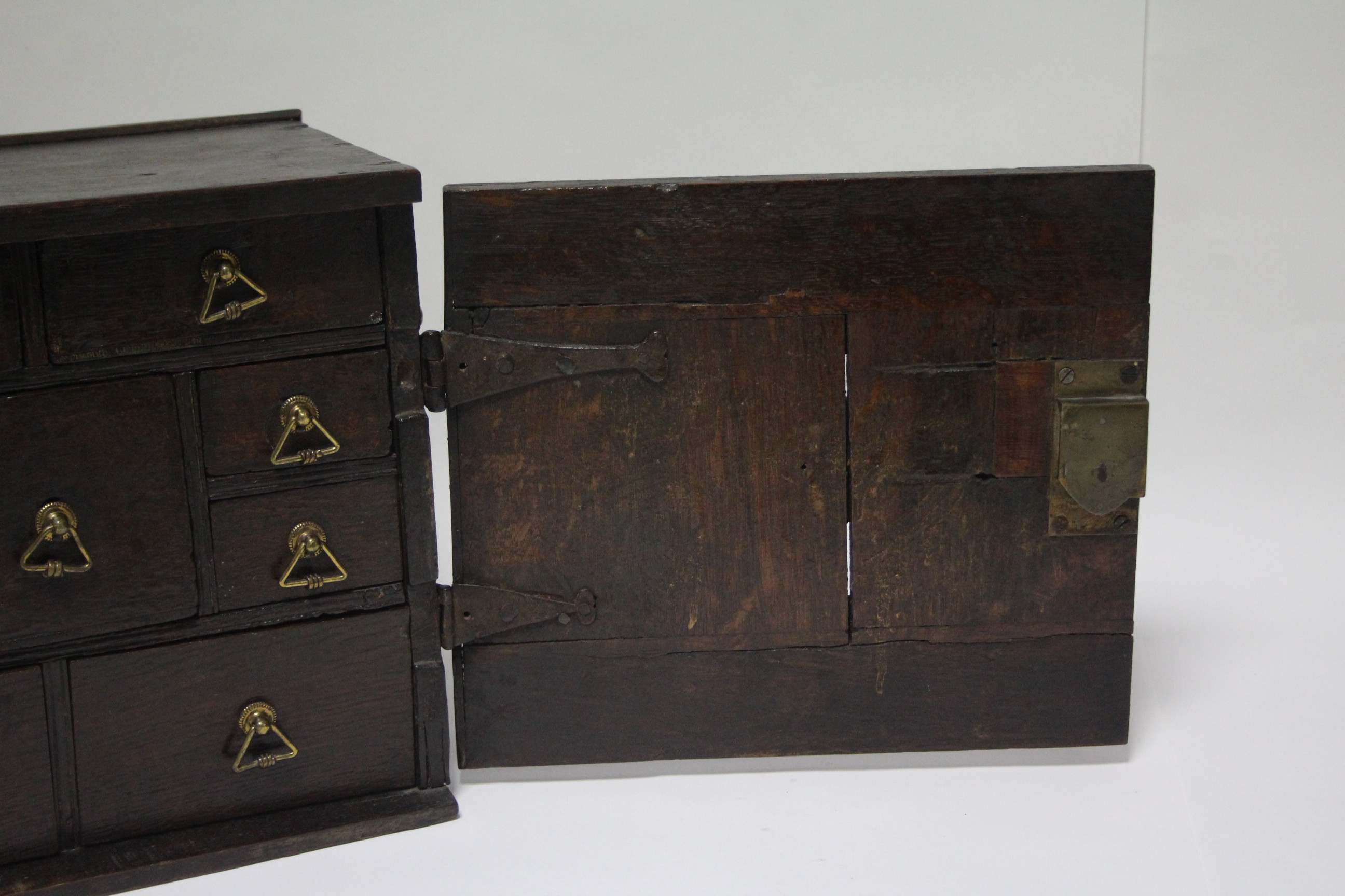 A late 17th/early 18th century oak small portable chest fitted with an arrangement of nine small - Image 4 of 5
