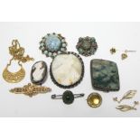 88. Two carved shell cameo brooches; a moss agate brooch; a scarab beetle brooch; a 9ct. gold bar