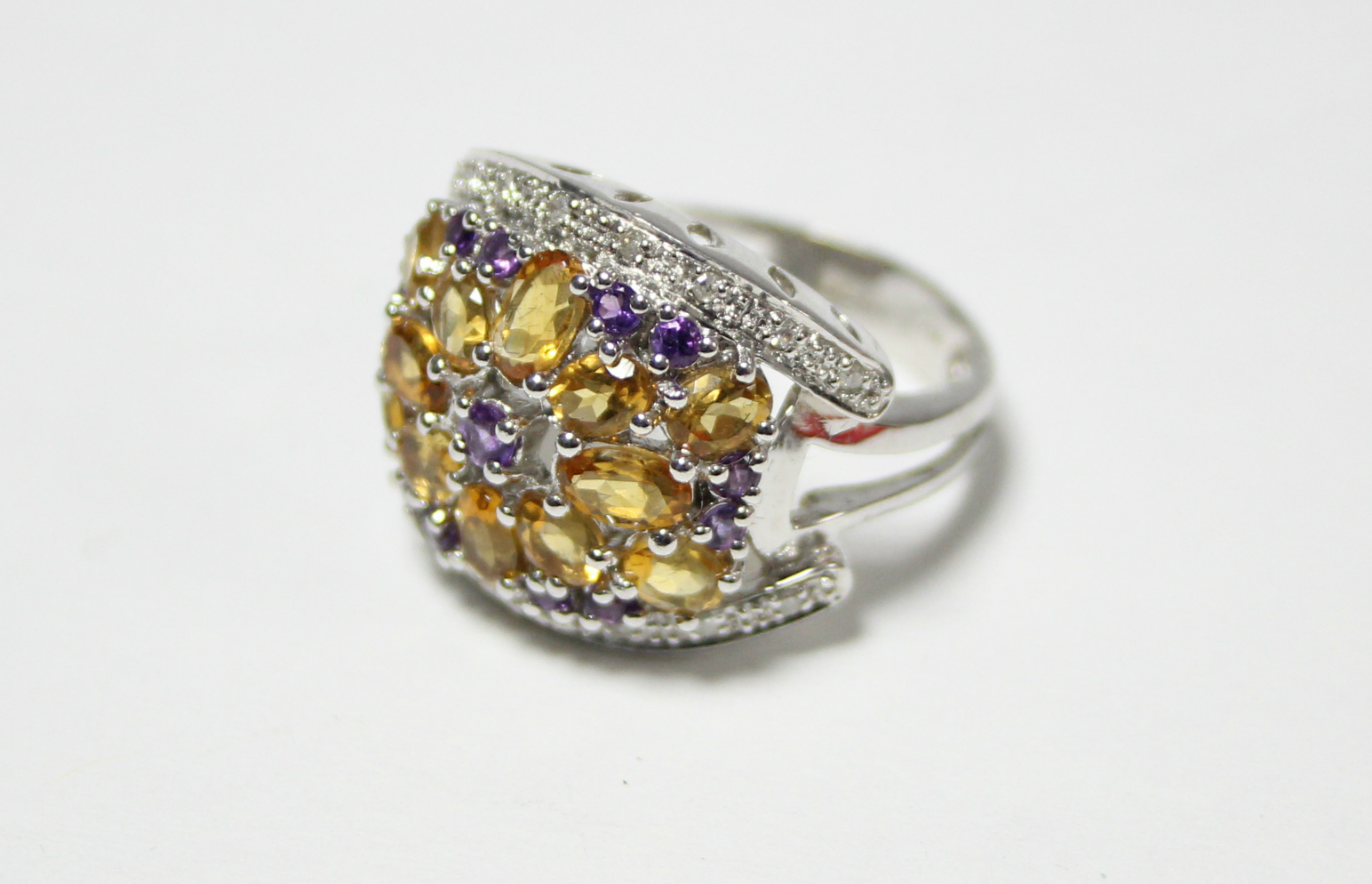 A 14K white gold ring with large cluster panel set small citrines, pink topaz, & diamonds. - Image 2 of 3