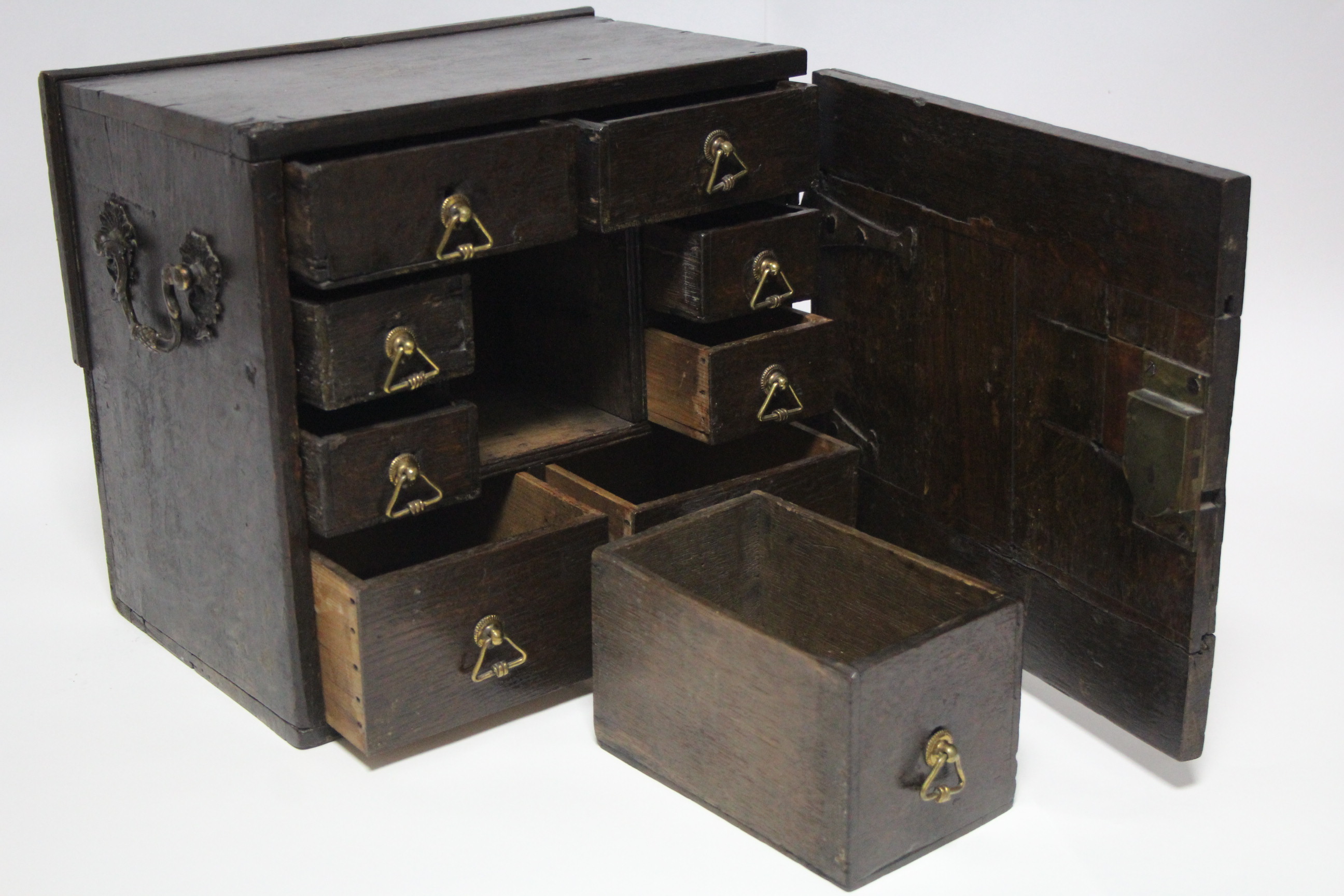 A late 17th/early 18th century oak small portable chest fitted with an arrangement of nine small - Image 2 of 5