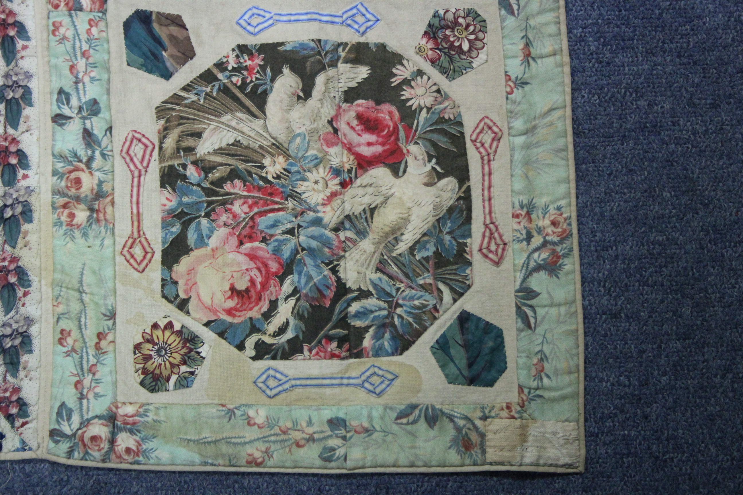 A VICTORIAN PATCHWORK BEDSPREAD or WALL HANGING comprising a wide variety of printed fabrics cut - Image 5 of 5