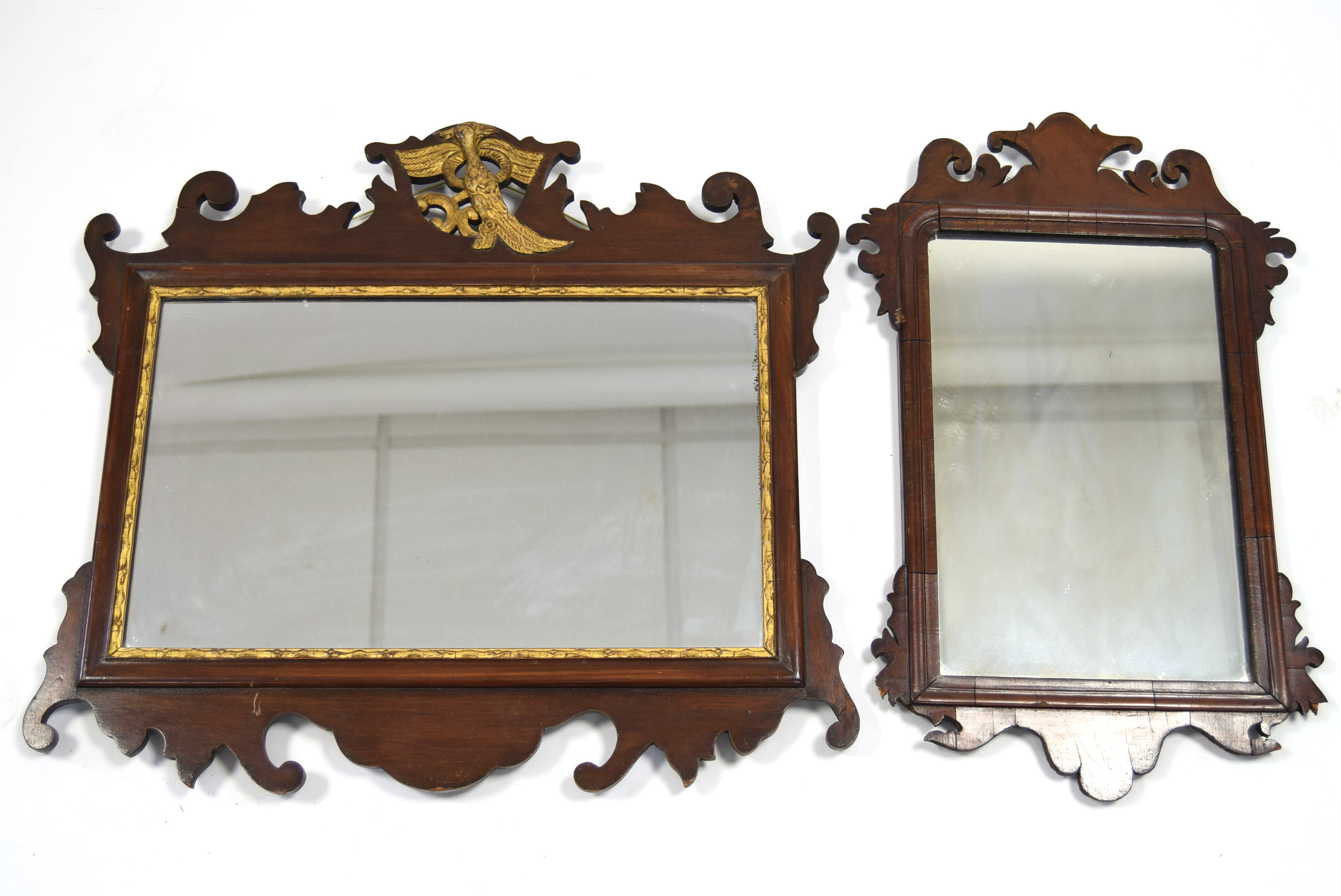 An 18th century-style rectangular wall mirror in mahogany fret-carved frame, 22½” x 20½”; & a