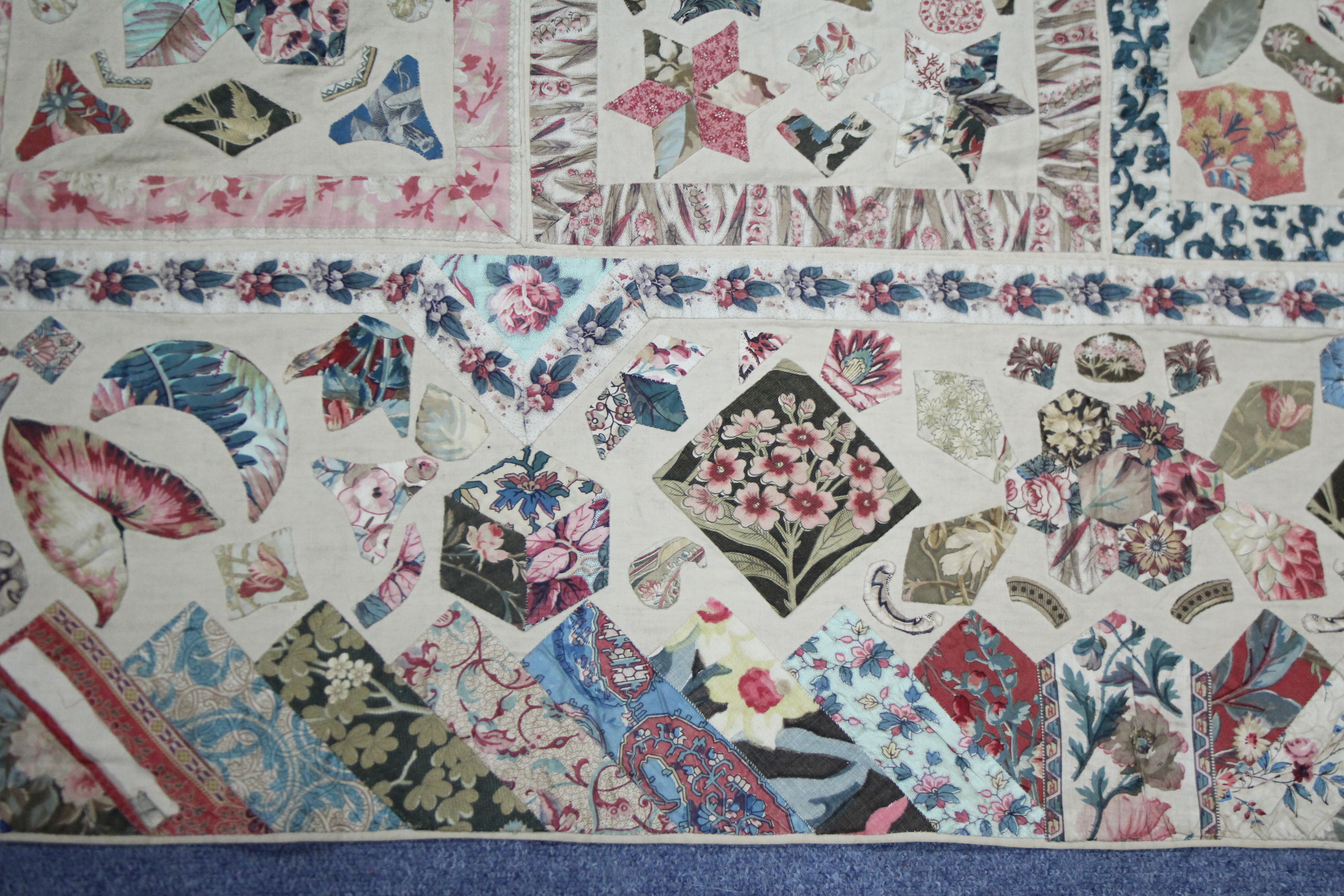 A VICTORIAN PATCHWORK BEDSPREAD or WALL HANGING comprising a wide variety of printed fabrics cut - Image 4 of 5