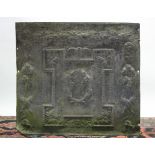 An 18th century lead cistern front with relief decoration of foliage & satyr masks, initials P.P., &