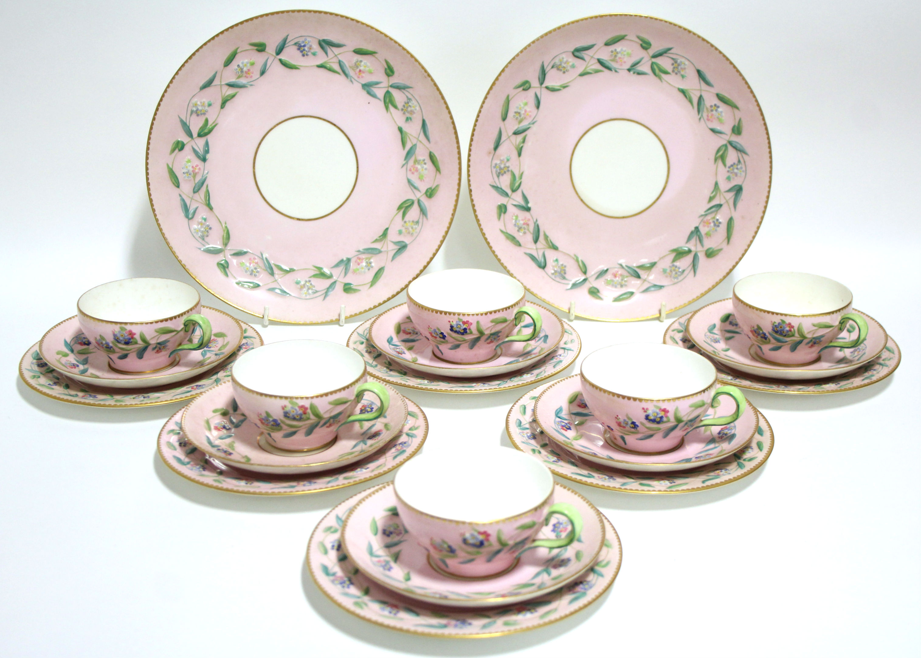 A 19th century Copeland porcelain tea service of pink ground with painted floral decoration in