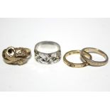 A 9ct. white gold band with star & diamond pattern; a 9ct. yellow gold flower-scroll ring (9.6gm