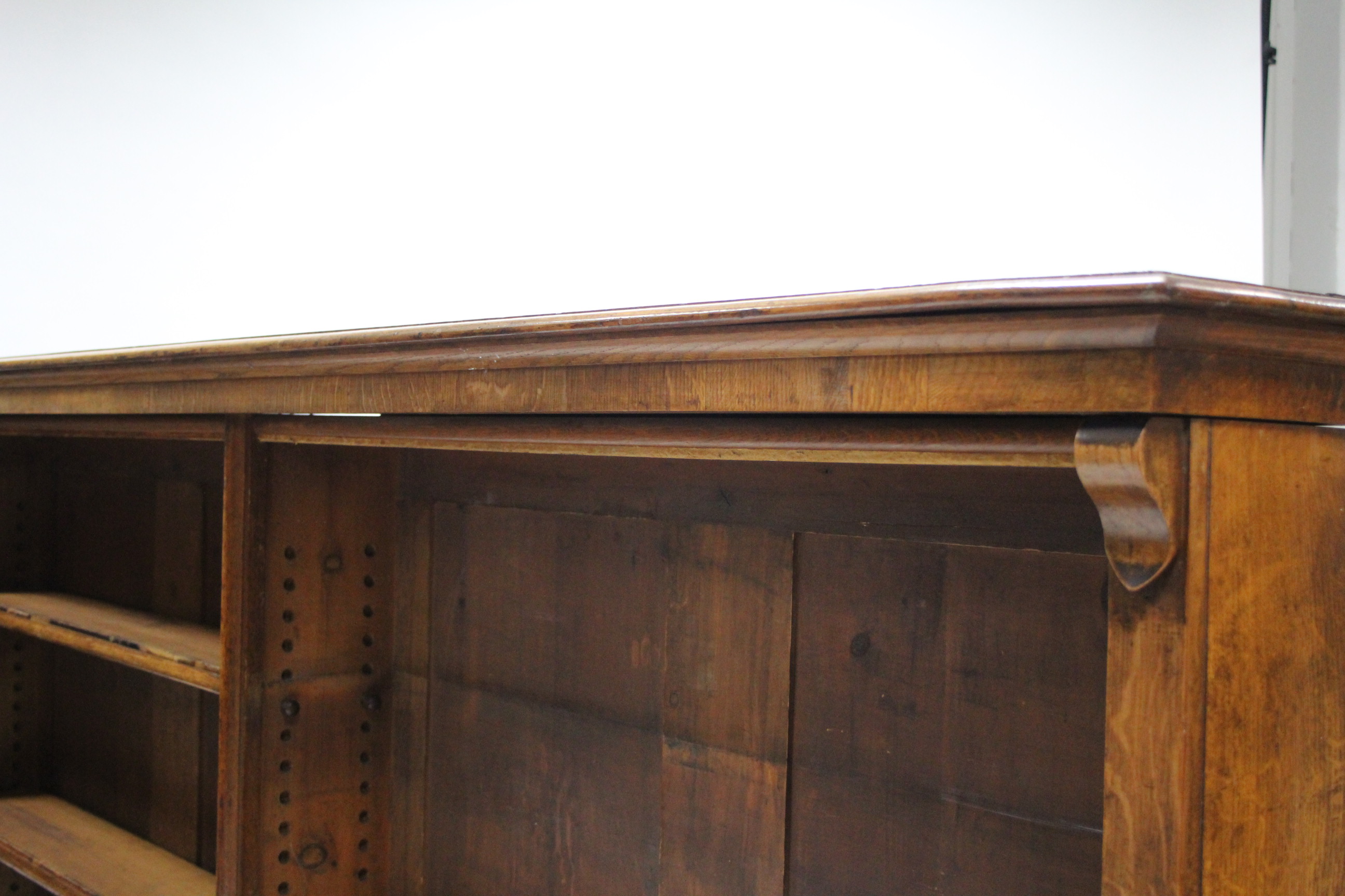 An early 19th century light oak standing open bookcase, having four adjustable shelves, plain scroll - Image 3 of 4