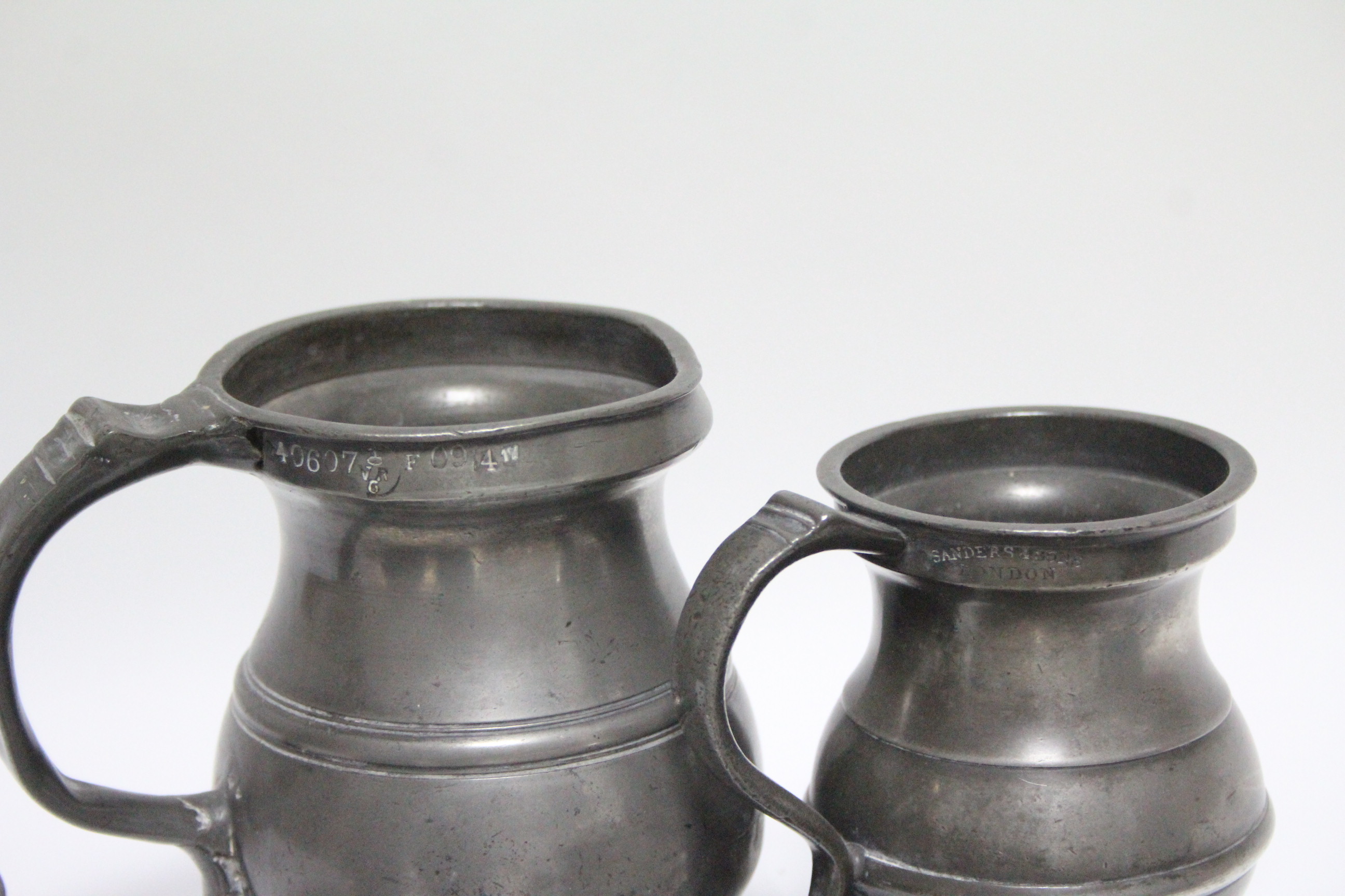 A matched set of seven pewter graduated measures, pint to quarter-gill; a pewter half-pint mug; a - Image 2 of 3