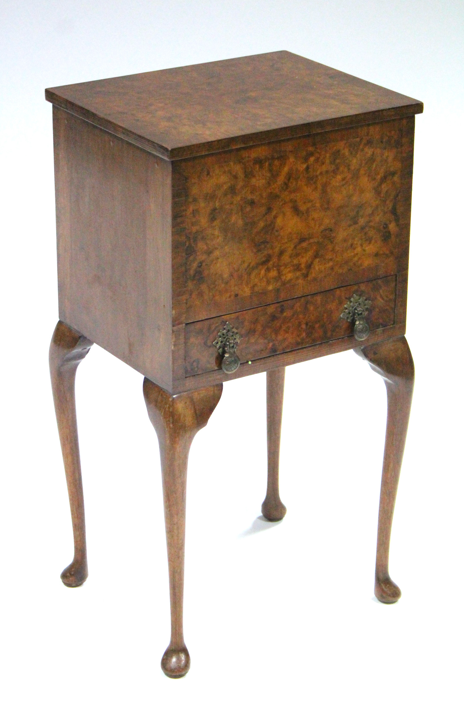 An early/mid-20th century burr-walnut veneered needlework table, the hinged lift-top enclosing