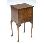 An early/mid-20th century burr-walnut veneered needlework table, the hinged lift-top enclosing