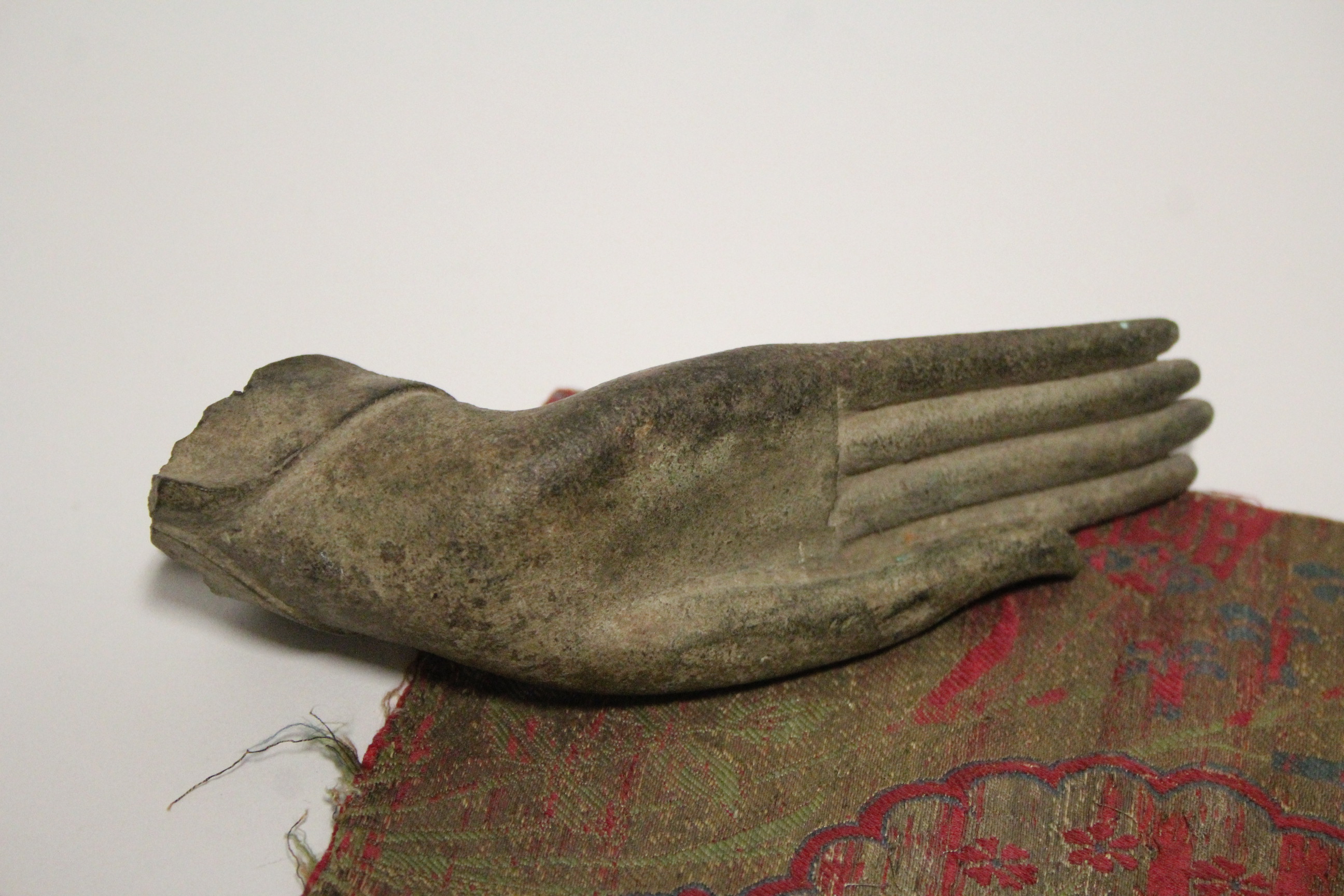 An early bronze fragmentary Buddhistic hand in extended position, 6½” long; & a small section of - Image 2 of 5