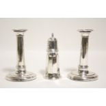 A pair of early 19th century candlesticks with slightly tapered oval columns & on oval bases, 7”