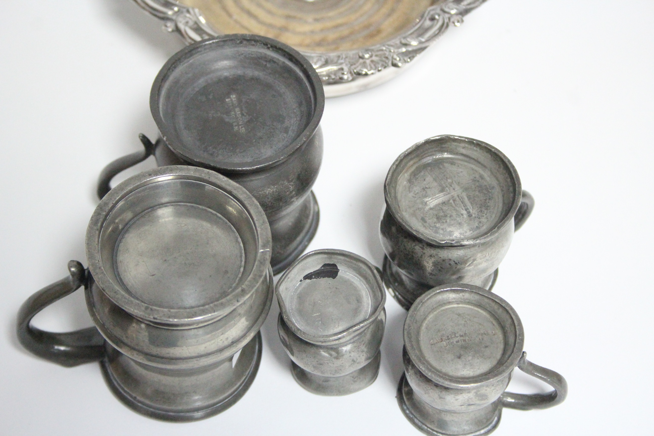 A matched set of seven pewter graduated measures, pint to quarter-gill; a pewter half-pint mug; a - Image 3 of 3