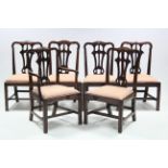 A set of six Irish mahogany dining chairs in the early George III style, with carved & pierced splat
