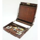 A portable artist’s box by J. Bryce-Smith, London, with various compartments & adjustable rest;