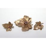 A 9ct. gold maple-leaf brooch set cluster of small amethysts; & pair of matching ear clips. (10.