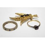 A 9ct. gold fern-leaf brooch set garnets & seed pearls; an engraved 9ct. gold eternity ring set