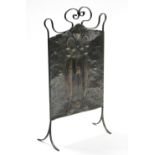 An early 20th century copper firescreen decorated in the Art Nouveau style, with wrought-iron scroll