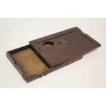 A late 19th/early 20th century mahogany portable artist’s box with adjustable rest & removable