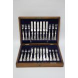 Twelve pairs of Elkington & Co. thread-&-scroll pattern dessert knives & forks, in fitted case.