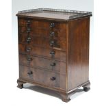 A mid-Victorian mahogany chest of six long graduated drawers with turned knob handles, the top