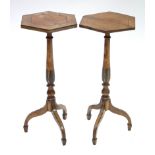 A pair of late George III-style pedestal tables, each figured mahogany hexagonal top on turned