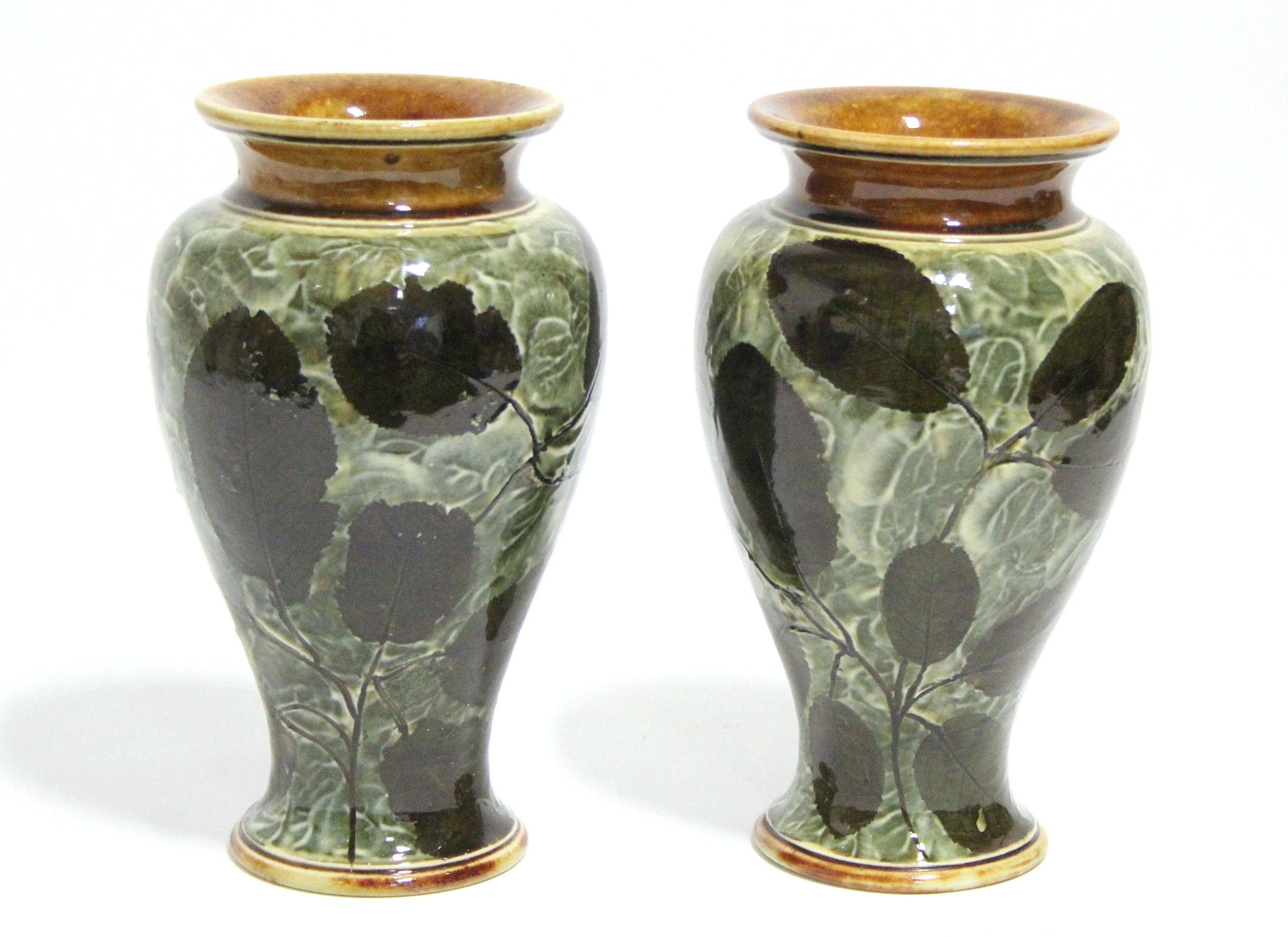 A pair of Royal Doulton stoneware round tapered vases decorated with the "Autumn Leaf" pattern;