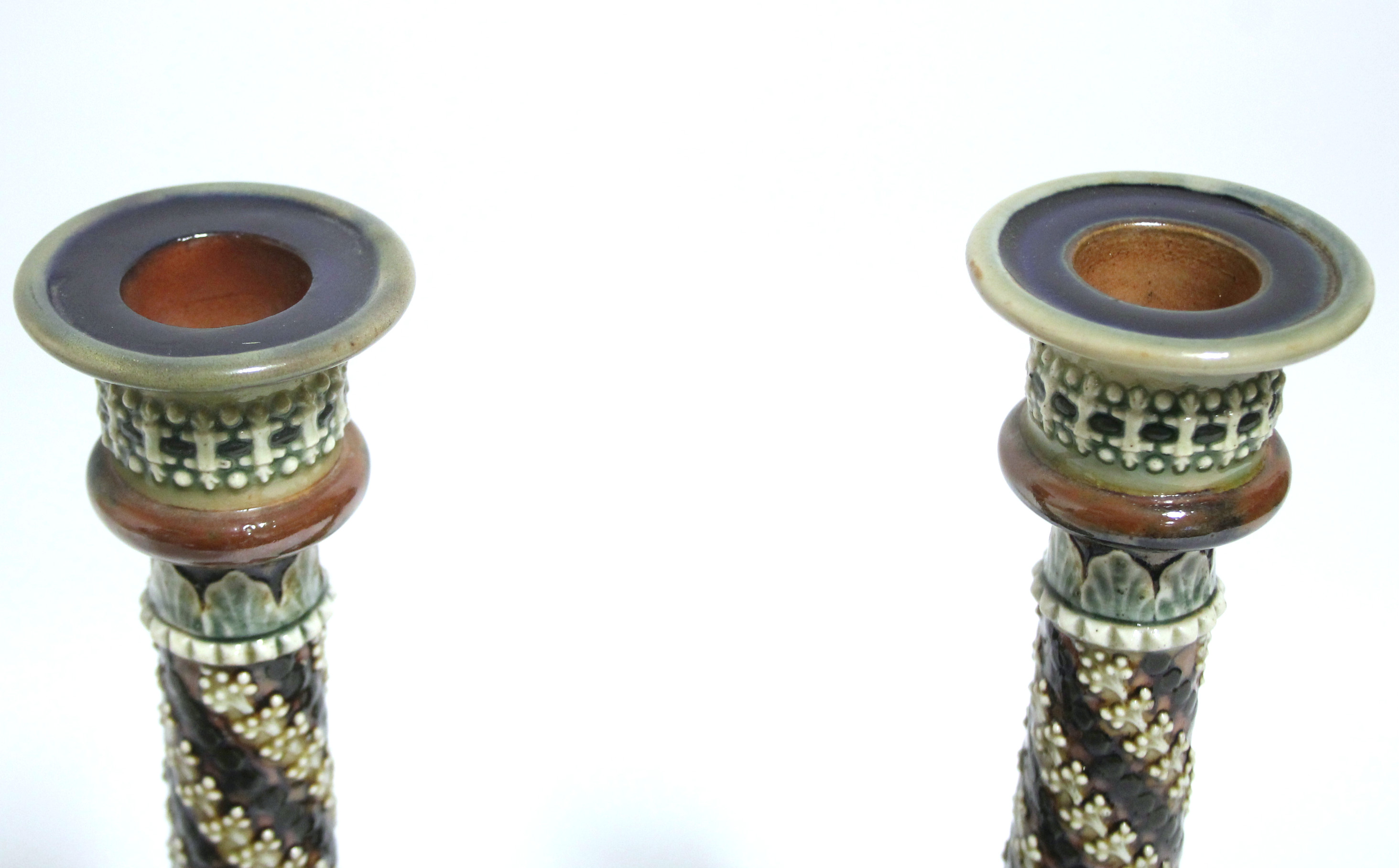 A pair of Doulton Lambeth stoneware candlesticks with round tapered columns &on circular domed - Image 2 of 5