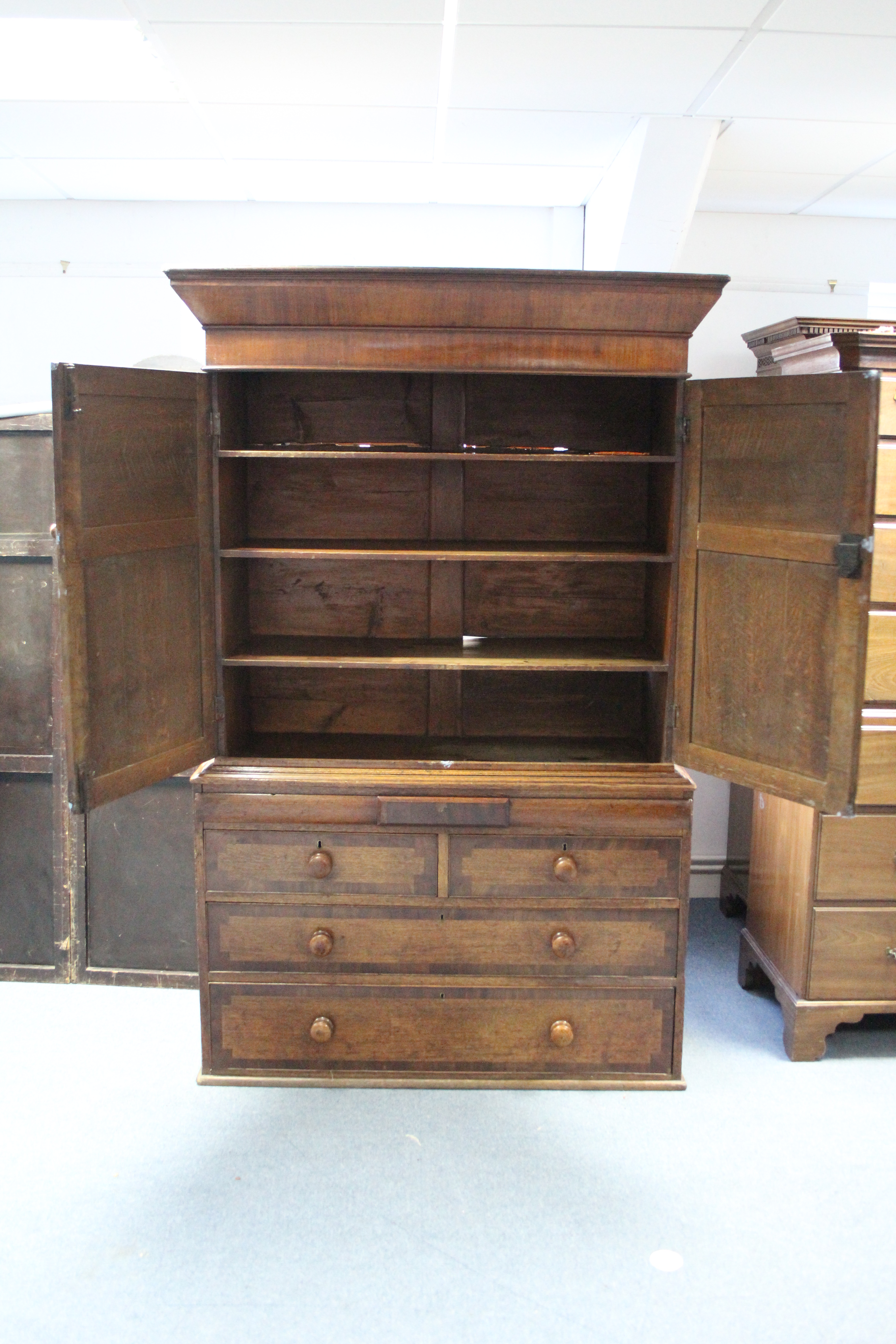 An early 19th century provincial oak & mahogany linen press, the upper part fitted three shelves - Image 2 of 4