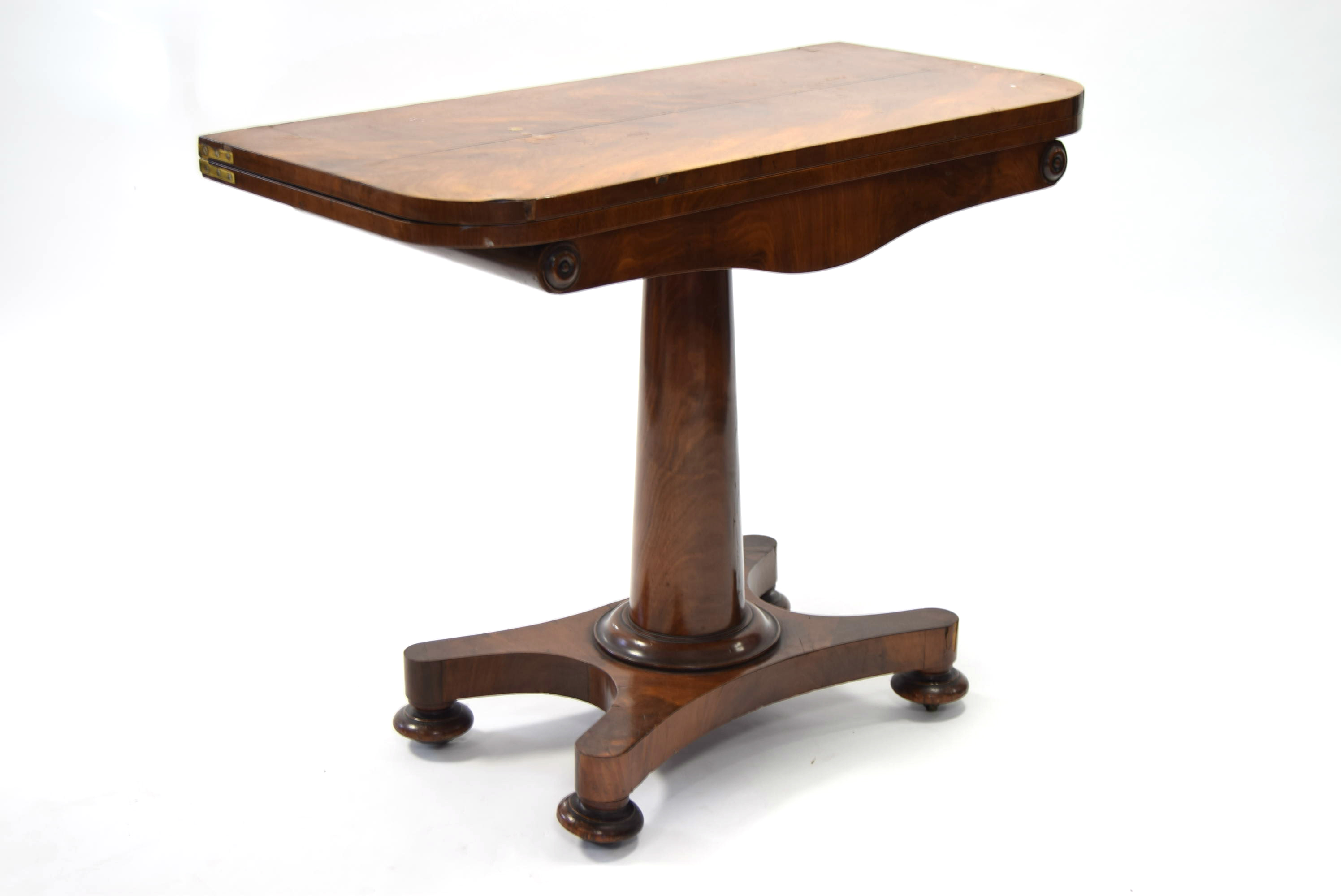 An early Victorian figured mahogany card table, the rectangular fold-over top inset circular pink