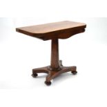 An early Victorian figured mahogany card table, the rectangular fold-over top inset circular pink