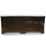 A Victorian mahogany low cabinet with plain moulded top above two cupboards, each