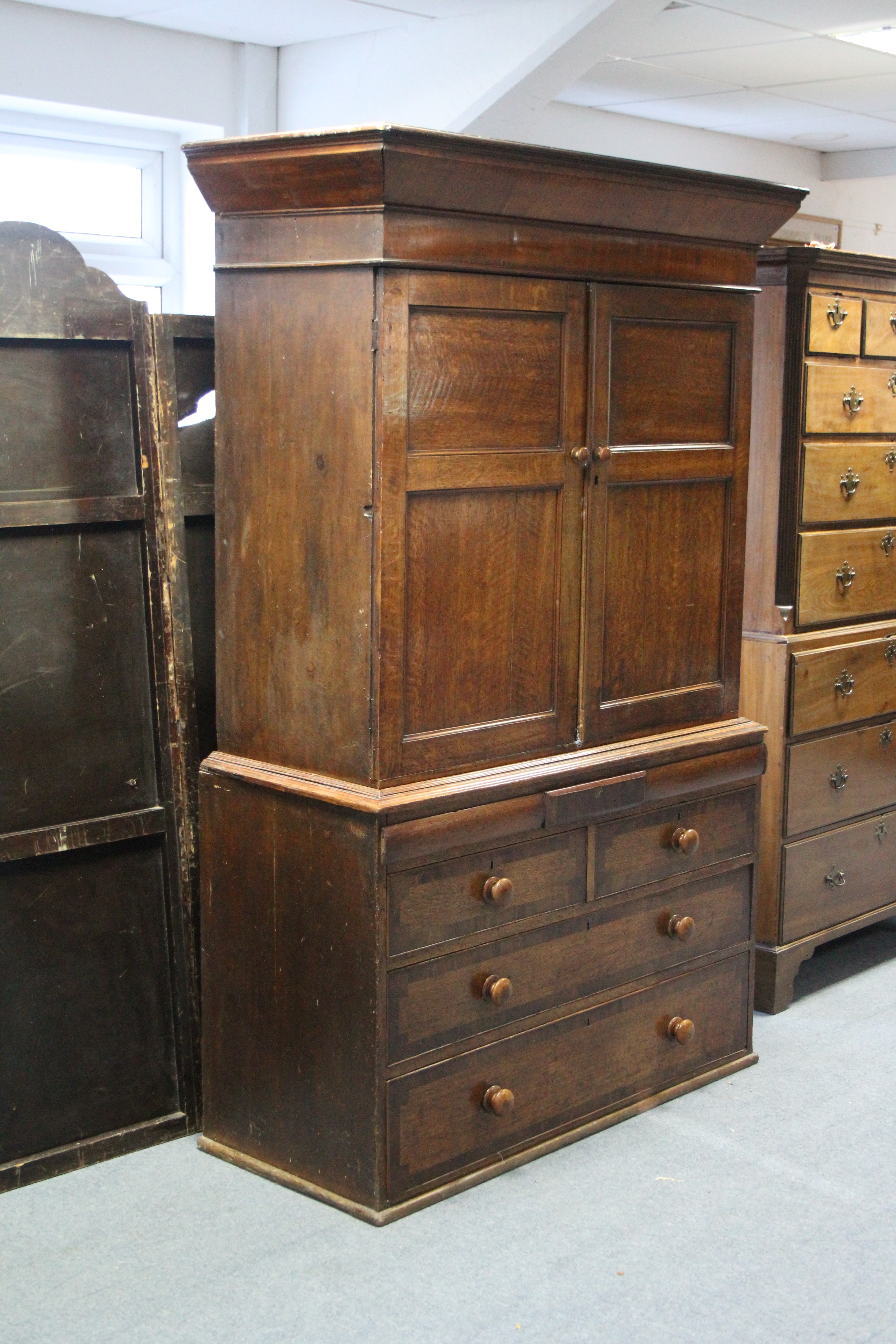 An early 19th century provincial oak & mahogany linen press, the upper part fitted three shelves - Image 3 of 4