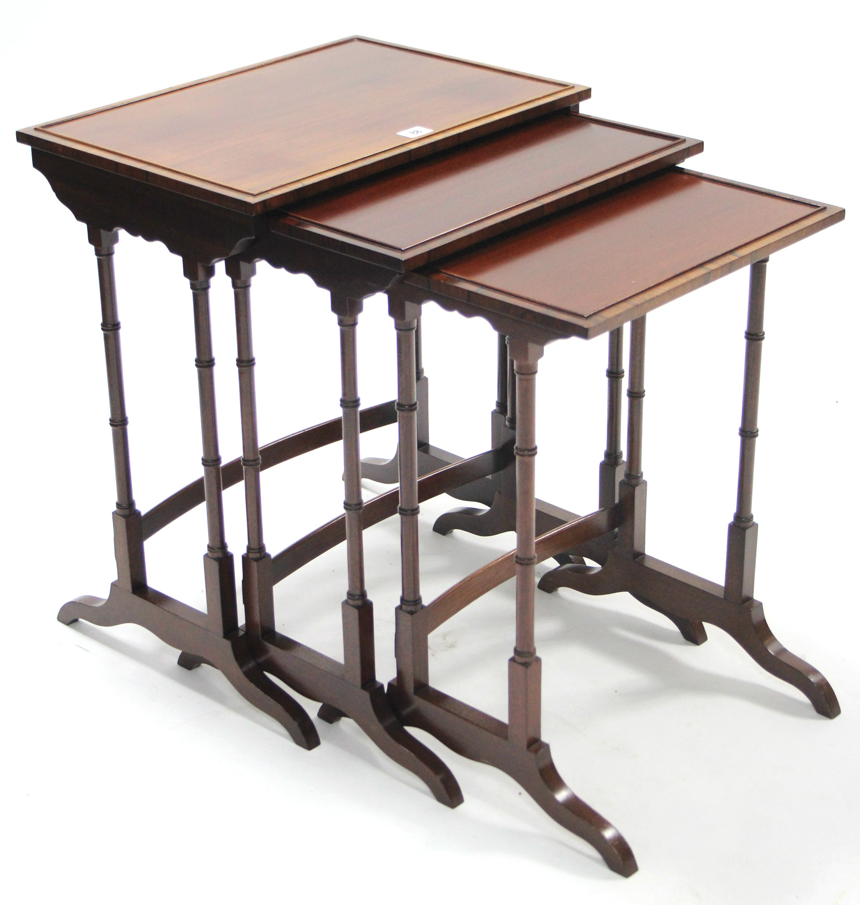 A mahogany nest of three rectangular occasional tables, each table on four spider-turned legs.