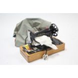 A Singer electric sewing machine with case, w.o.