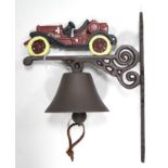 A modern painted cast-iron house bell with vintage motor car surmount, 13" high.