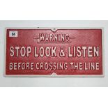 A reproduction painted cast-iron railway notice "WARNING STOP LOOK & LISTEN BEFORE CROSSING THE