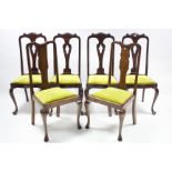 A set of four 1930’s mahogany dining chairs in the Queen Anne style with carved & pierced shaped